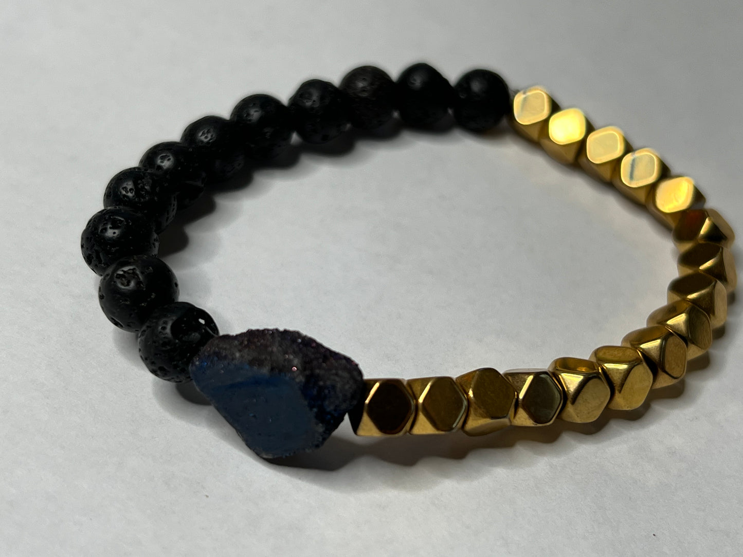 Gold Plated Hematite, Black Lava Stone and a Blue Titanium Geode