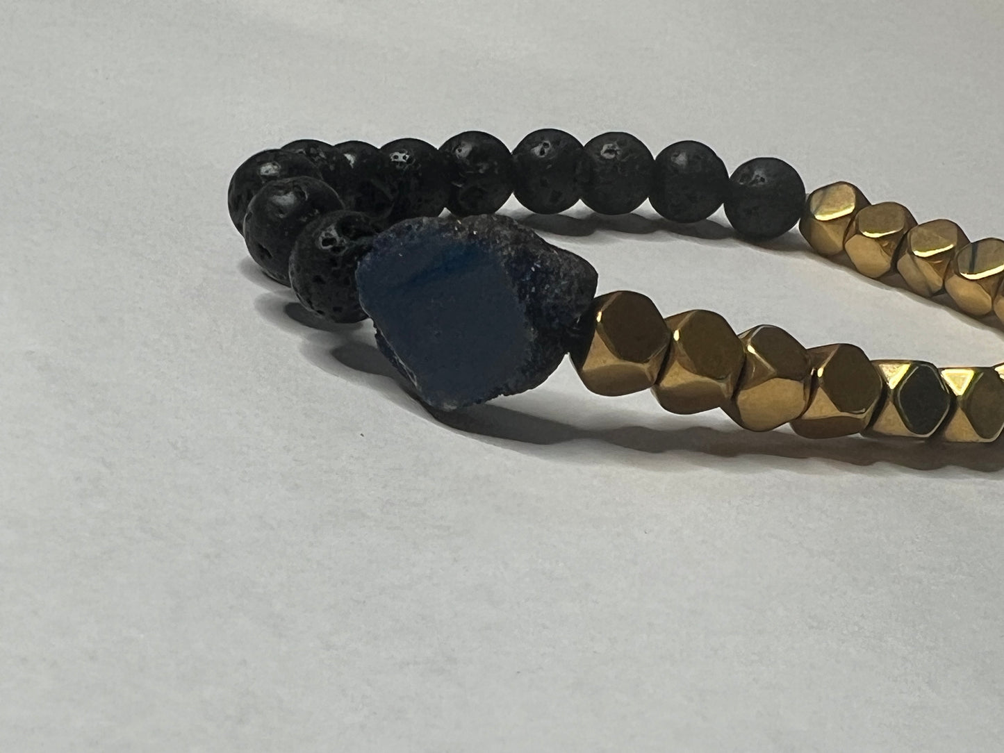 Gold Plated Hematite, Black Lava Stone and a Blue Titanium Geode
