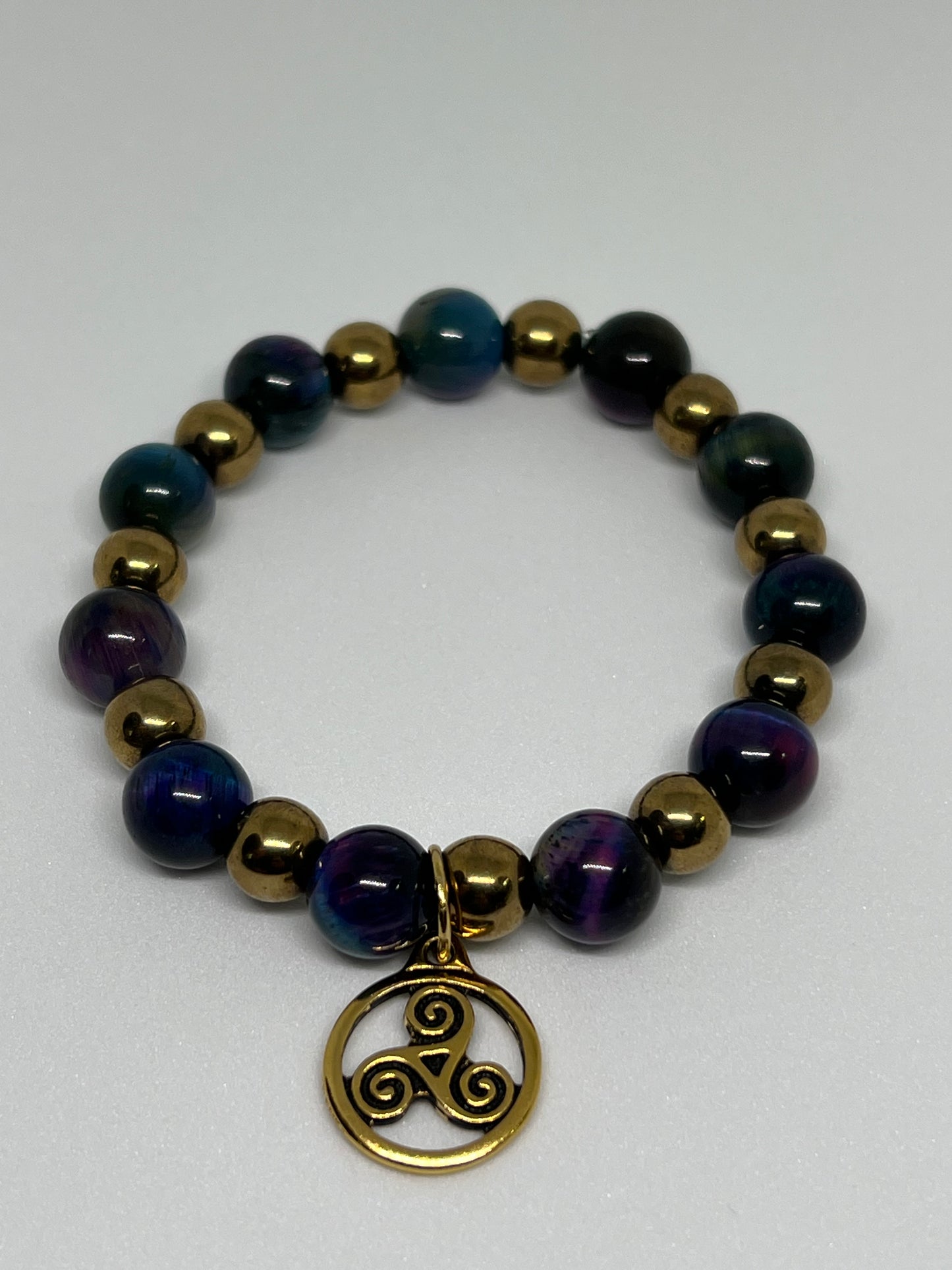 Galaxy Tiger’s Eye and Gold Plated Hematite with a Triskelion Gold Tone Charm